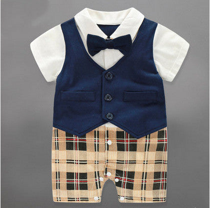 Baby boy formal outfit with navy vest, white shirt, bow tie, and plaid shorts – perfect for special occasions