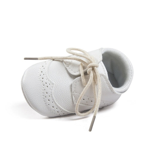 Ancient Energy men's baby shoes with soft soles, ideal for walking and early stages of toddler development.