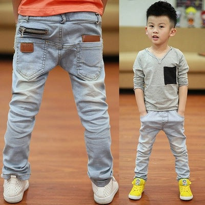 Boy wearing Ancient Energy spring and autumn pants, lightweight and comfortable kids' trousers for seasonal wear.