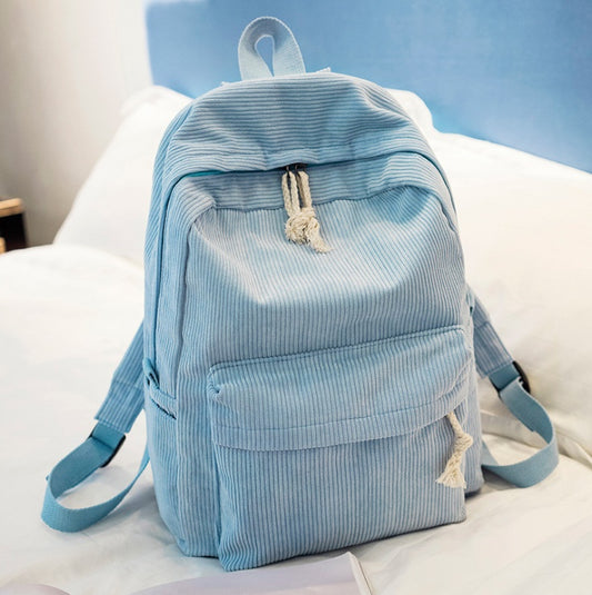 Ancient Energy corduroy backpack for students with shoulder straps, stylish school bag with multiple compartments.