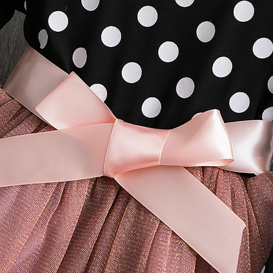 Polka dot princess dress for girls by Ancient Energy, featuring a playful design with ruffles and a bow on the front.