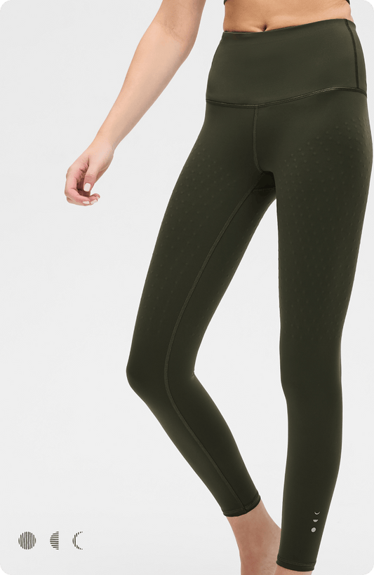 Olive green high-waisted yoga leggings with dot texture and side seams, ideal for fitness and activewear