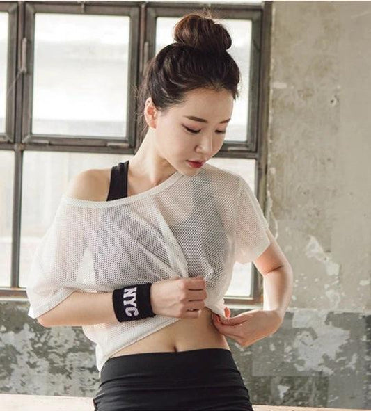Ancient Energy women's yoga shirt with hollow-out mesh design, breathable crop top for running, fitness, and gym workouts.