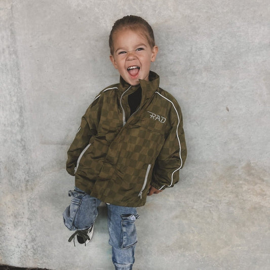 Little Rad Things Storm Rider waterproof jacket in army green, shown with front zipper and hood for outdoor protection.