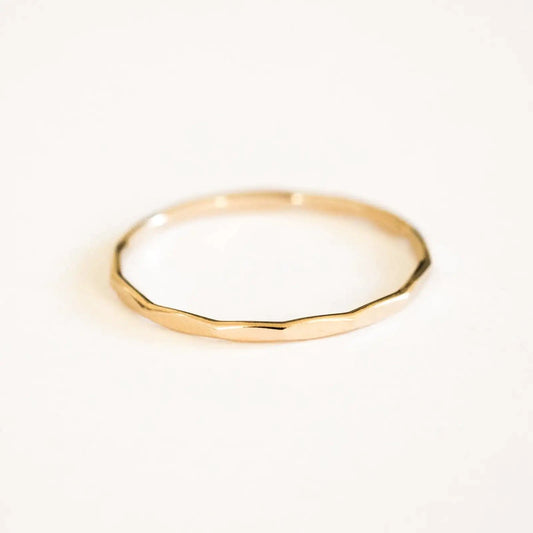 14K gold-filled textured stacking ring from MANDOTOS, showcasing a detailed hammered finish on a slim band.