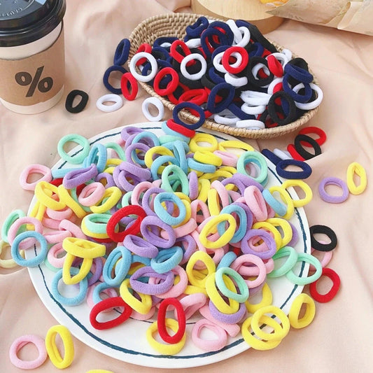 Set of 20/50 kids elastic hair bands with colorful sweets designs, suitable for girls' hair ties, clips, and headbands.