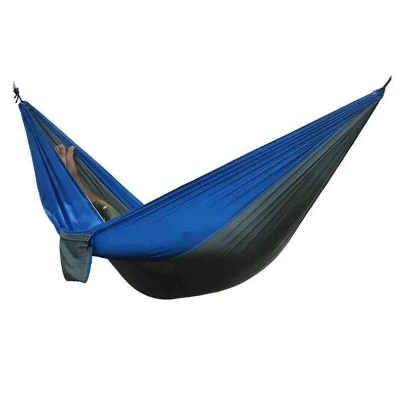 Mandotos Adventure Hammock Pack with durable fabric and hanging straps, perfect for outdoor camping and relaxing in nature.