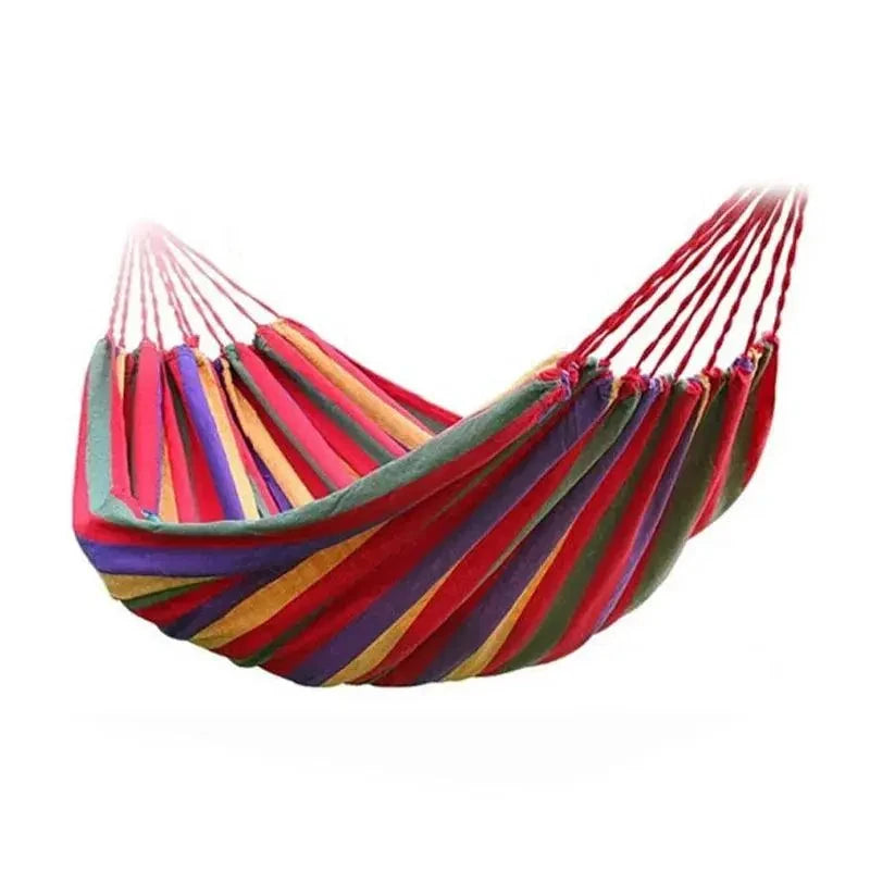 Mandotos Adventure Ready Hammock hanging between trees, lightweight and durable outdoor camping gear for relaxing in nature.