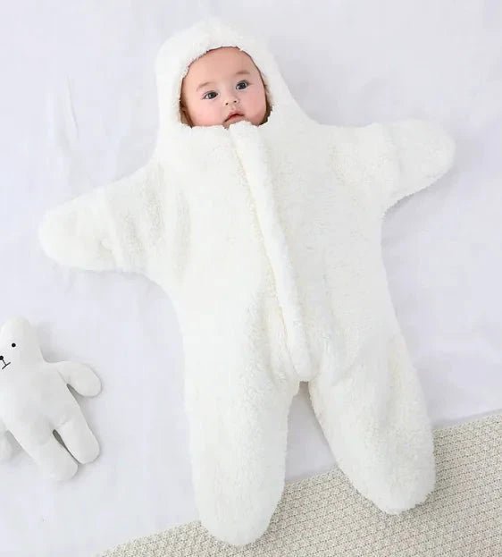 Soft baby quilt by MANDOTOS with colorful patterns, perfect for keeping infants cozy and comfortable.