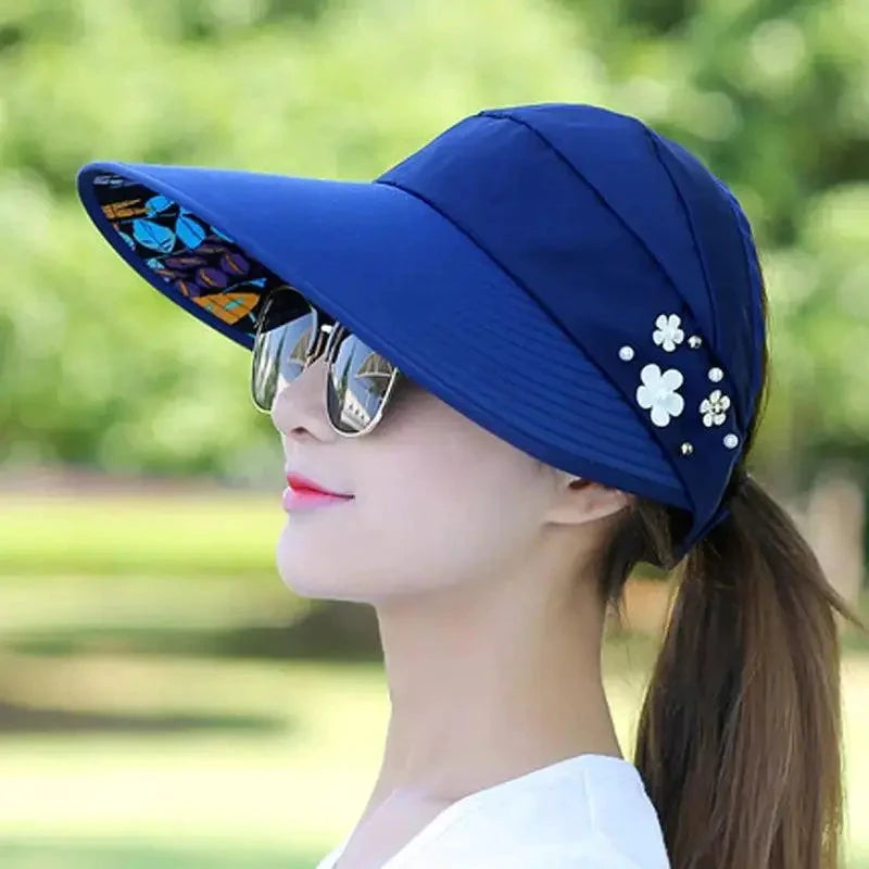 Mandotos Breezy Pearl Visor Hat with wide brim and pearl accents for sun protection and stylish summer wear.