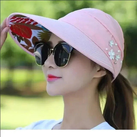 Mandotos Breezy Pearl Visor Hat featuring a wide brim and pearl accents, perfect for sun protection and stylish outdoor wear.