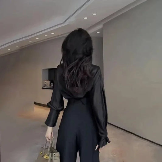 Mandotos chic flowy wide-leg trousers with a relaxed fit, high waist, and lightweight fabric displayed on a model.