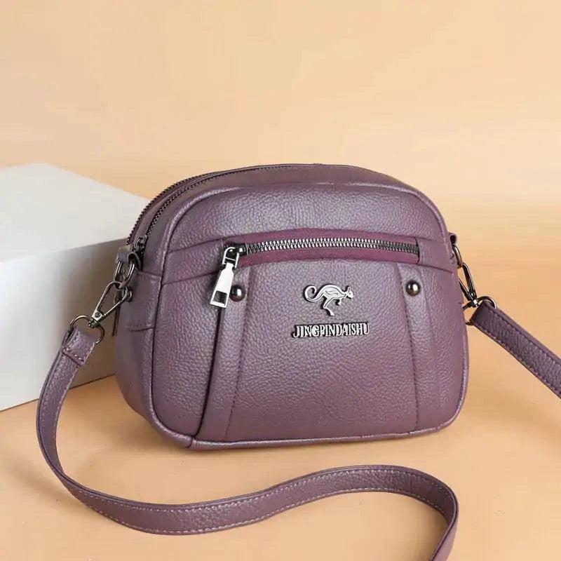 Mandotos chic leather circle purse with a sleek design, featuring a smooth leather finish and a stylish round shape.