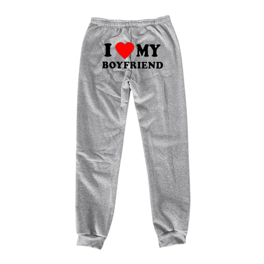 Mandotos Chic Love Print Trousers featuring a stylish love-themed pattern on lightweight fabric.