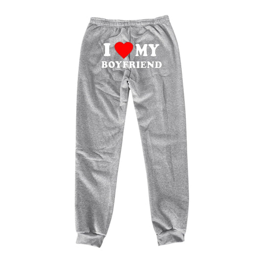 Mandotos Chic Love Print Trousers featuring a stylish pattern, relaxed fit, and comfortable fabric for casual or trendy wear.