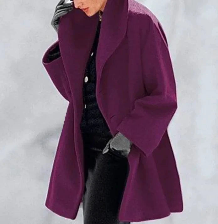 Mandotos chic multi-shade oversized cardigan displayed on a model, featuring a cozy, stylish knit with varied colorful shades.