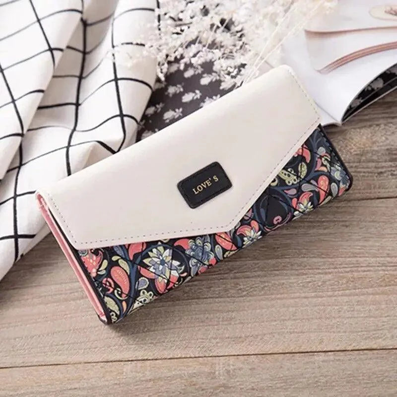 Mandotos chic women's leather clutch wallet and card holder with sleek design and multiple compartments for cards and cash.
