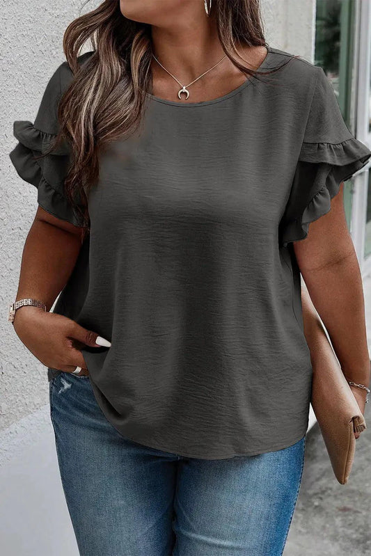 Mandotos Curvy Samantha Blouse in vibrant fabric, featuring a stylish design with a fitted silhouette and elegant details.