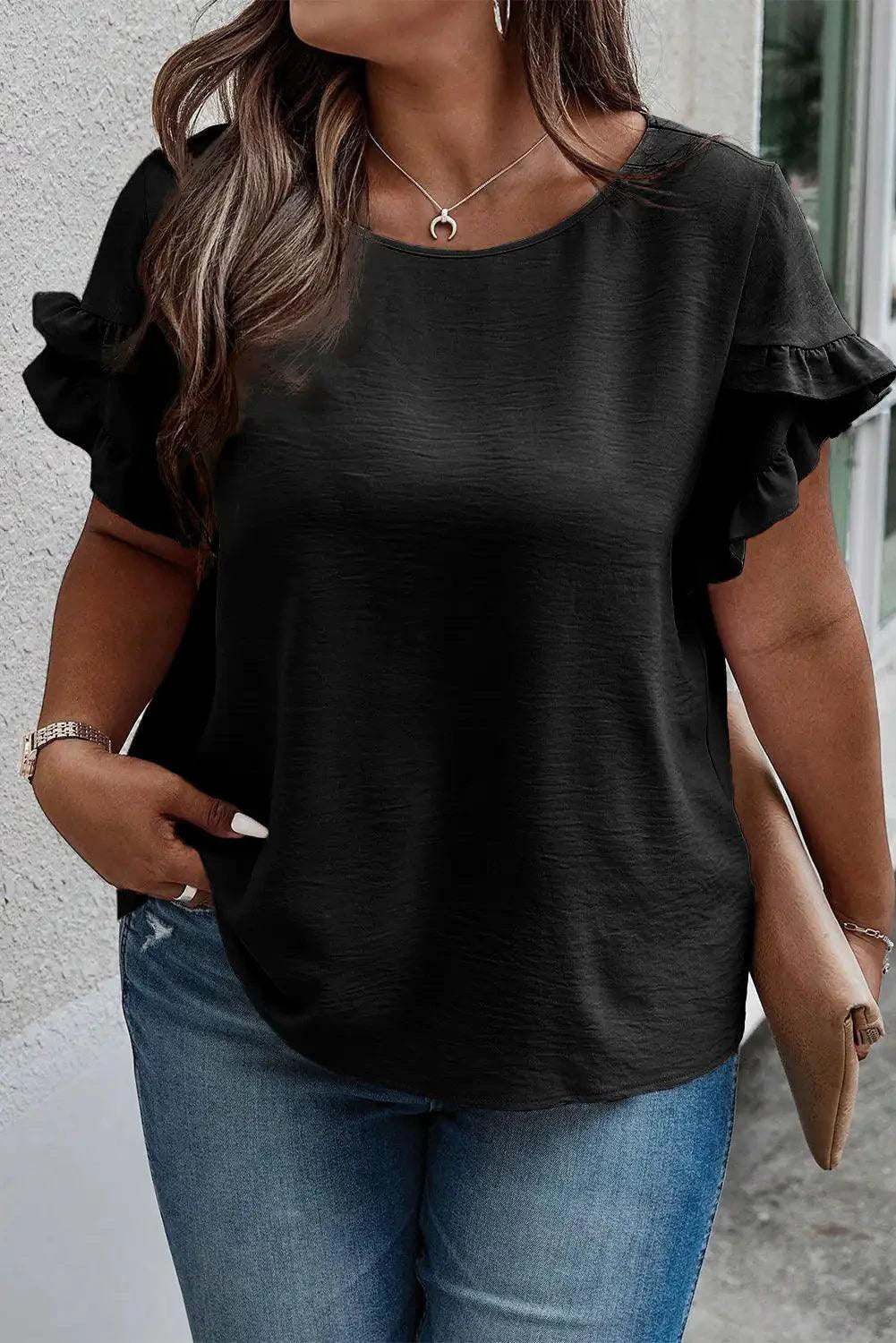 Mandotos Curvy Samantha Blouse featuring a stylish, flowy design with vibrant patterns and a comfortable fit for curvy figures.