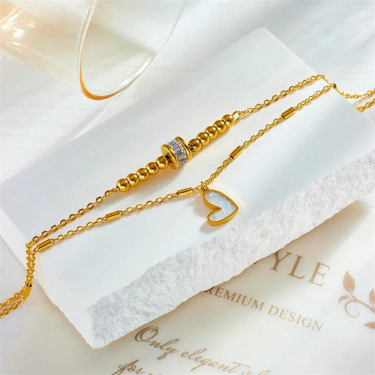 Mandotos boho love heart ankle chain with double-layer design, charm tassels, and leg chain for women’s party jewelry accessories.