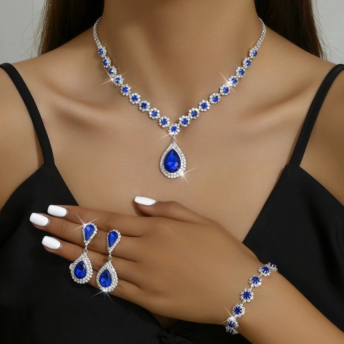 Mandotos bridal jewelry set including necklace, ear studs, and bracelet with elegant design for special occasions.