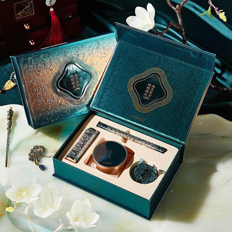 Mandotos Oriental Beauty Co. Chinese-inspired makeup set featuring an elegant palette with bold, vibrant eyeshadows and brushes.