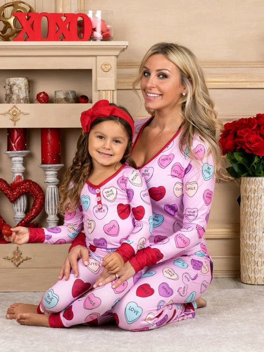Matching Valentine's Day love print pajamas for parent and child by MANDOTOS, featuring cozy, festive sleepwear for both.