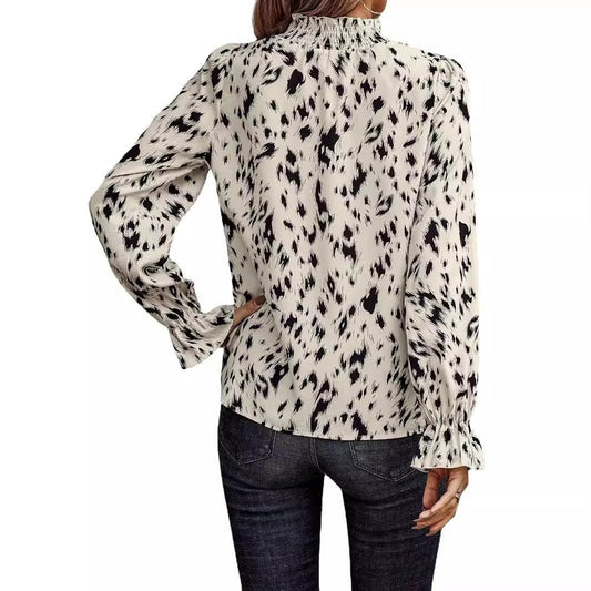 Women's long sleeve turtleneck shirt by MANDOTOS, showcasing a fitted design and ribbed fabric in a neutral color.
