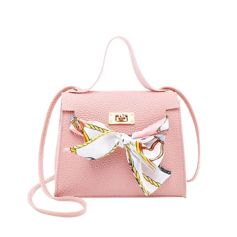Elegant leather handbag and matching scarf by MANDOTOS, featuring stylish design and quality craftsmanship.