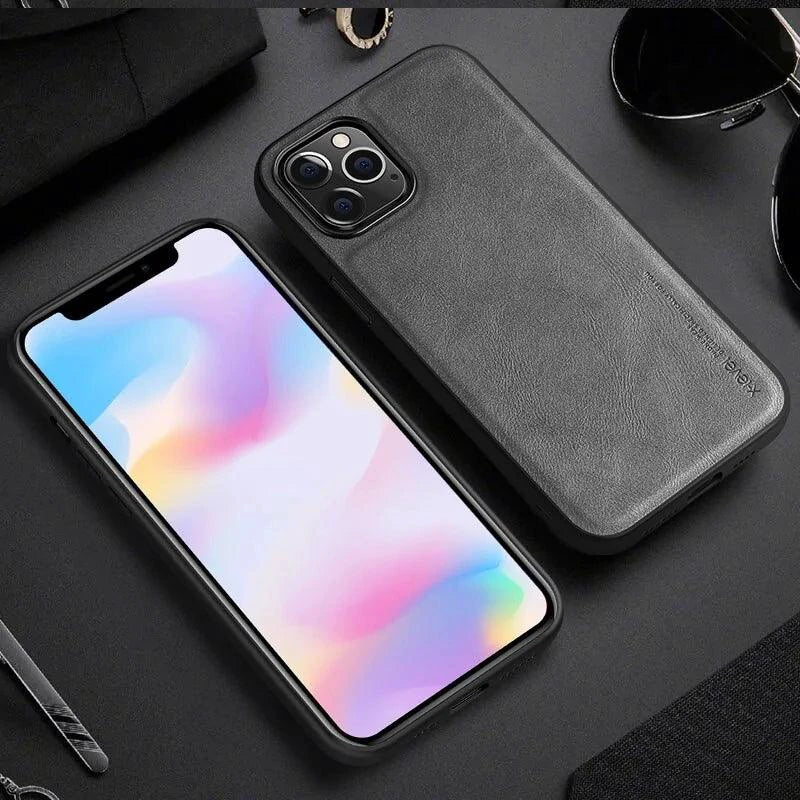 Elegant leather iPhone shield by MANDOTOS, showcasing a sleek protective case with smooth leather finish and precise cutouts.