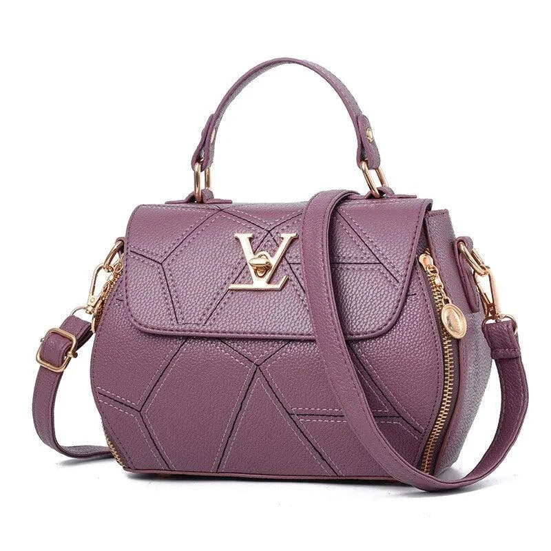 Elegant leather tote bag by MANDOTOS with sturdy handles and sleek design, perfect for everyday use.