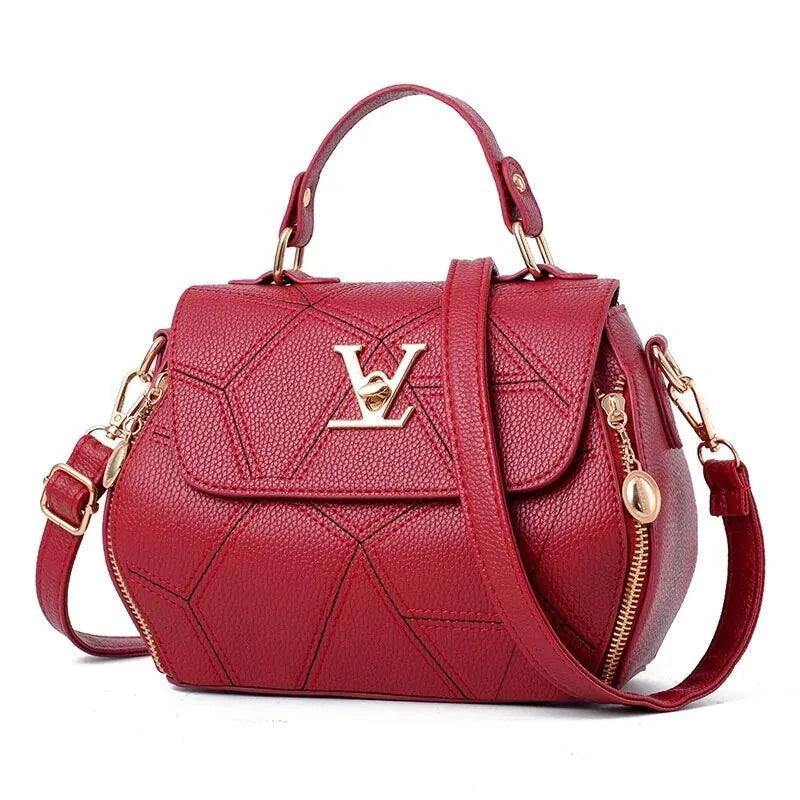 Elegant leather tote bag by MANDOTOS, showcasing a sleek design with sturdy handles and smooth leather finish.