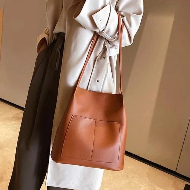 Elegant women's tote bag by MANDOTOS featuring sleek design and spacious interior, perfect for daily use and stylish accessories.