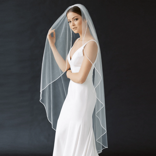 Long flowing bridal veil from ElegantBride V14 by MANDOTOS, featuring delicate lace edging and lightweight tulle fabric.