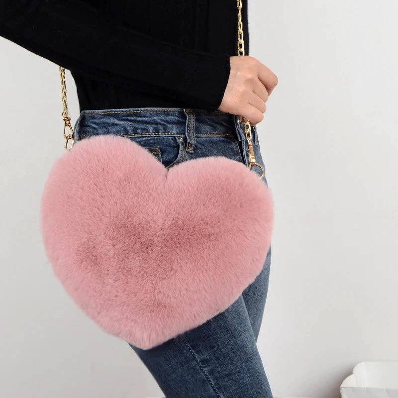 Mandotos women's heart-shaped faux fur crossbody bag with plush soft texture, chain shoulder strap, ideal for stylish casual wear.