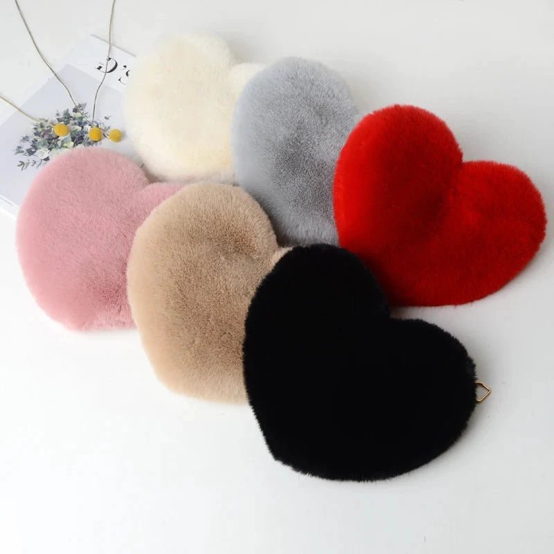 Mandotos women's heart-shaped faux fur crossbody bag with plush chain strap, soft tote for casual or evening wear.