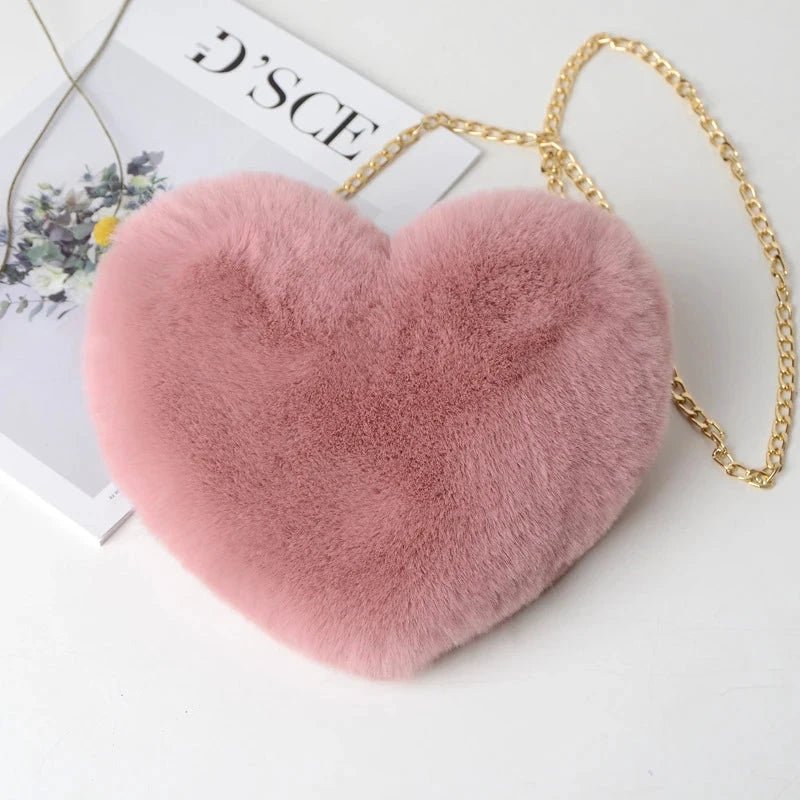 Cute heart-shaped faux fur handbag by MANDOTOS, soft plush crossbody bag with chain shoulder strap and tote style for women.