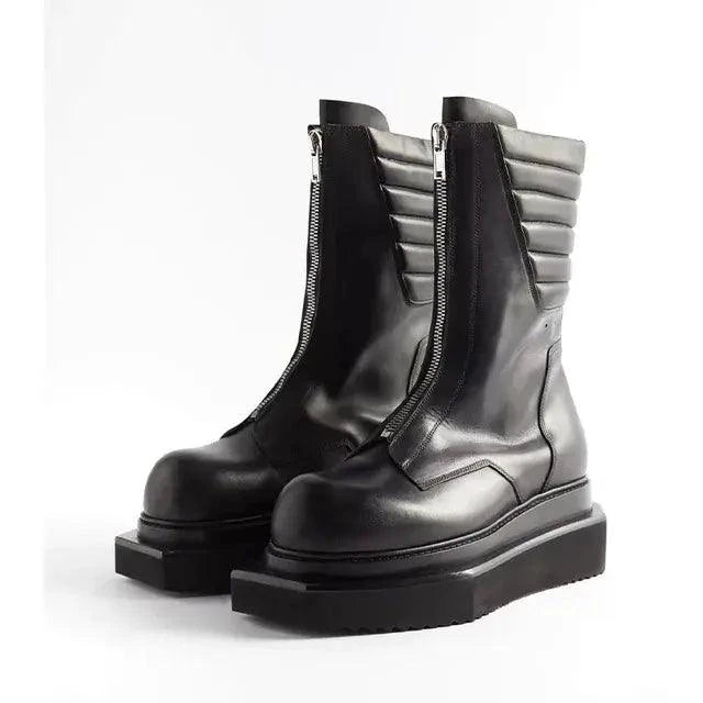 Pair of genuine leather men's boots by MANDOTOS featuring a sleek design and sturdy soles, perfect for casual or formal wear.
