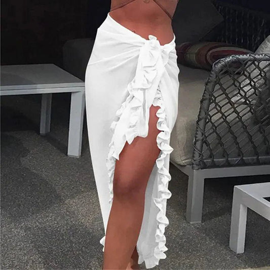 Mandotos GlamourWave chiffon beach wrap draped over a model, showcasing its lightweight, elegant design for sunny day beach wear.