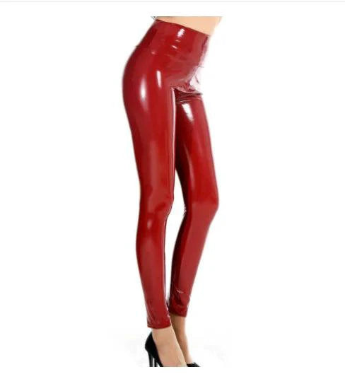 Glossy latex leather leggings by MANDOTOS, showing shiny black material with a close-up of the fitted, high-waisted design.