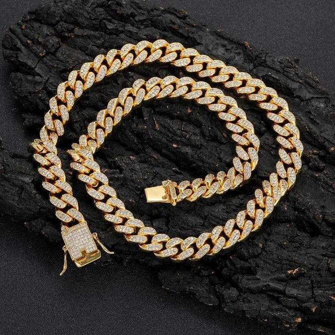 Gold Shine Iced Cuban Chain by MANDOTOS featuring a luxurious iced design and chunky Cuban link style for a bold jewelry look.