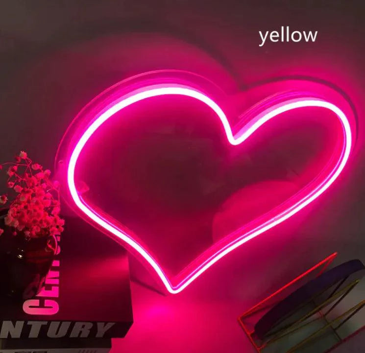 Mandotos Heart Glow LED Neon Light glowing with vibrant pink light, perfect for home decor and ambient lighting.