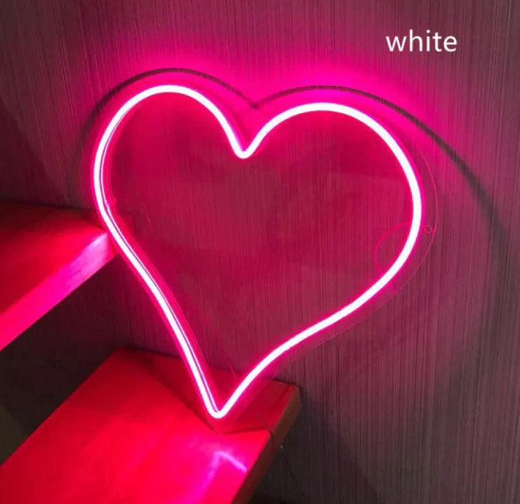 Mandotos Heart Glow LED Neon Light emitting a soft pink hue, ideal for room decor and adding a vibrant touch to your space.