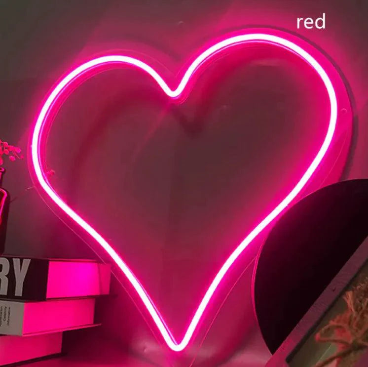 Mandotos Heart Glow LED Neon Light with bright pink glow, shaped like a heart, ideal for room decor or mood lighting.
