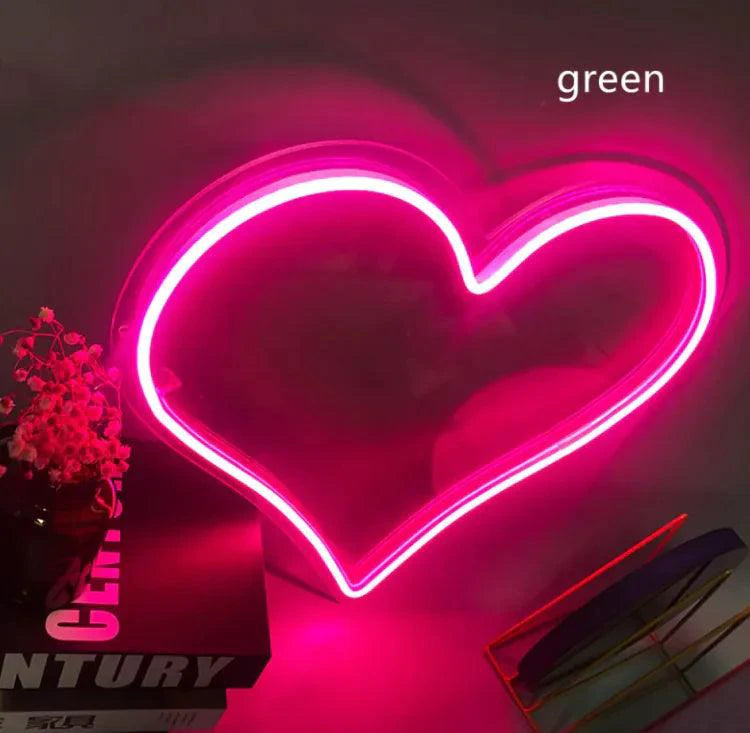 Mandotos Heart Glow LED Neon Light illuminated in vibrant pink, showcasing a glowing heart-shaped design for home decor.