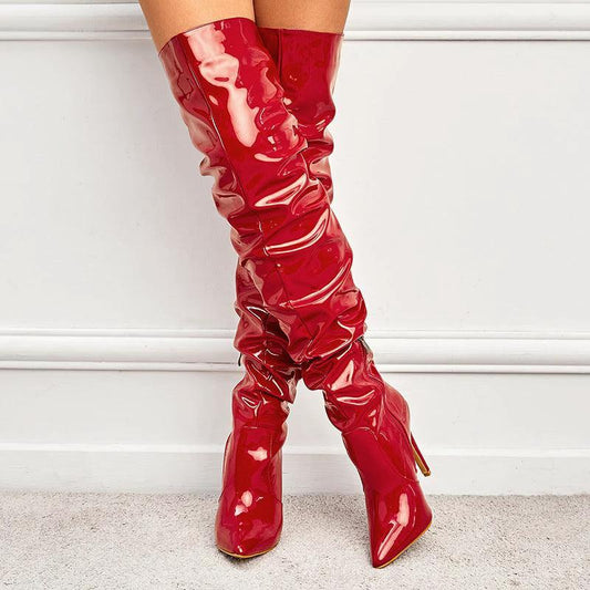 Black high heel elastic knee-length patent leather boots by MANDOTOS with sleek design and shiny finish.