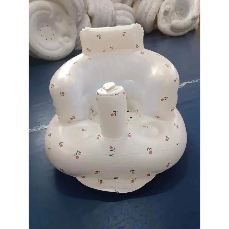 Inflatable baby chair by MANDOTOS designed for dining and bath, featuring a soft, durable surface and secure seating for infants.