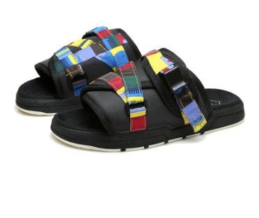 Chic unisex beach slides by MANDOTOS INTERNATIONAL featuring stylish design and comfortable slip-on style for beachwear.