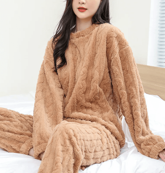 Mandotos International cozy coral velvet sleepwear set with long-sleeve top and matching pants on a model.
