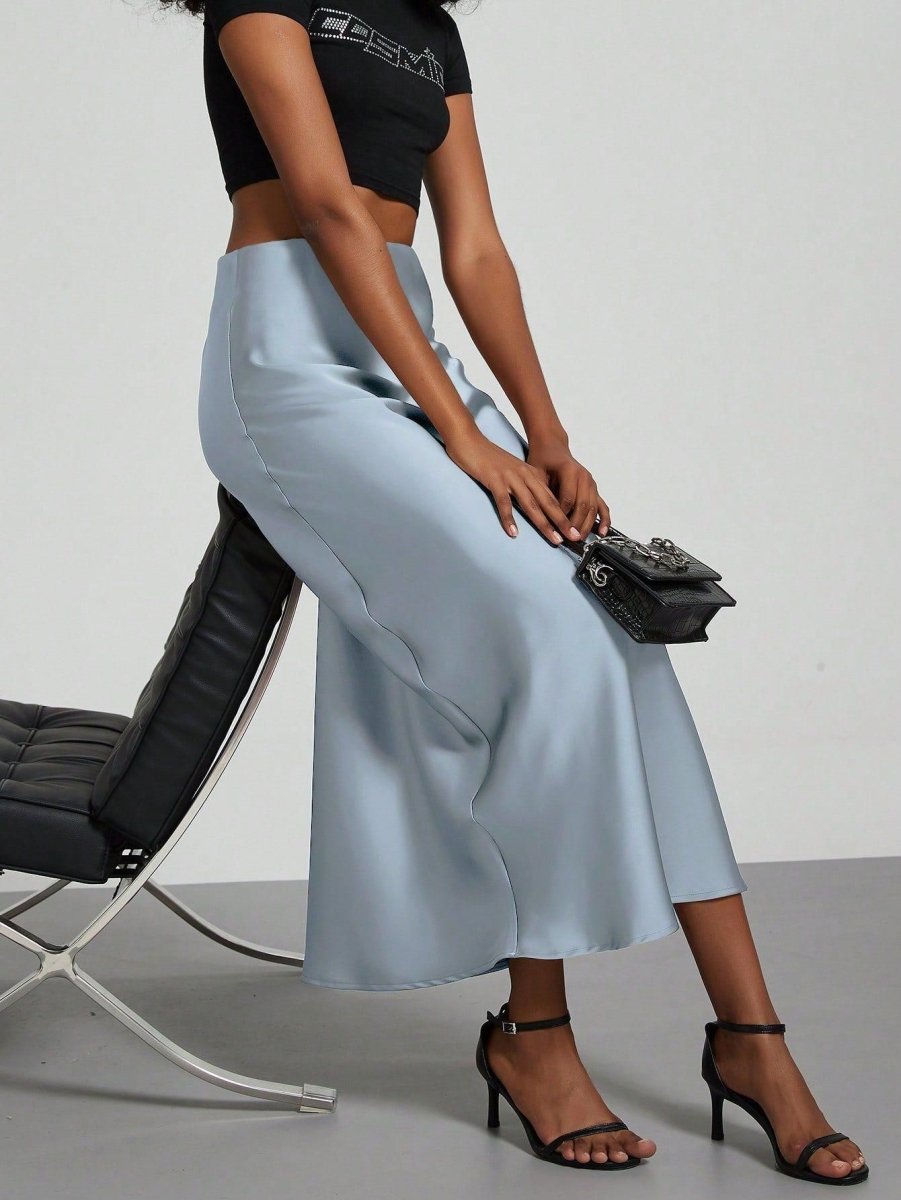 European American style satin midi skirt by Mandotos International, shown in a sleek, flowing design perfect for versatile fashion.